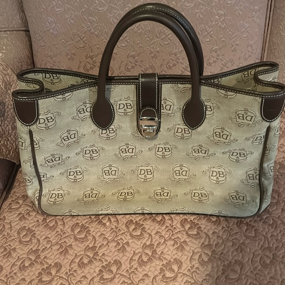 Dooney and Bourke donegal crest satchel. Canvas and leather